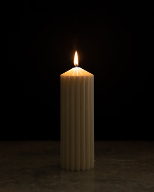 Tall Column Pillar Candle Lighted Up and glowing